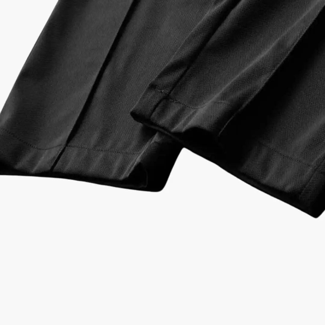 Men's summer two-piece outfit set in black by Wilfred Smith; fabric visible on short-sleeve shirt and slim-fit pants.