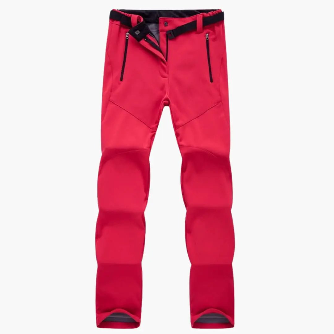 Women's hiking pants with zipper pockets in red by Wilfred Smith