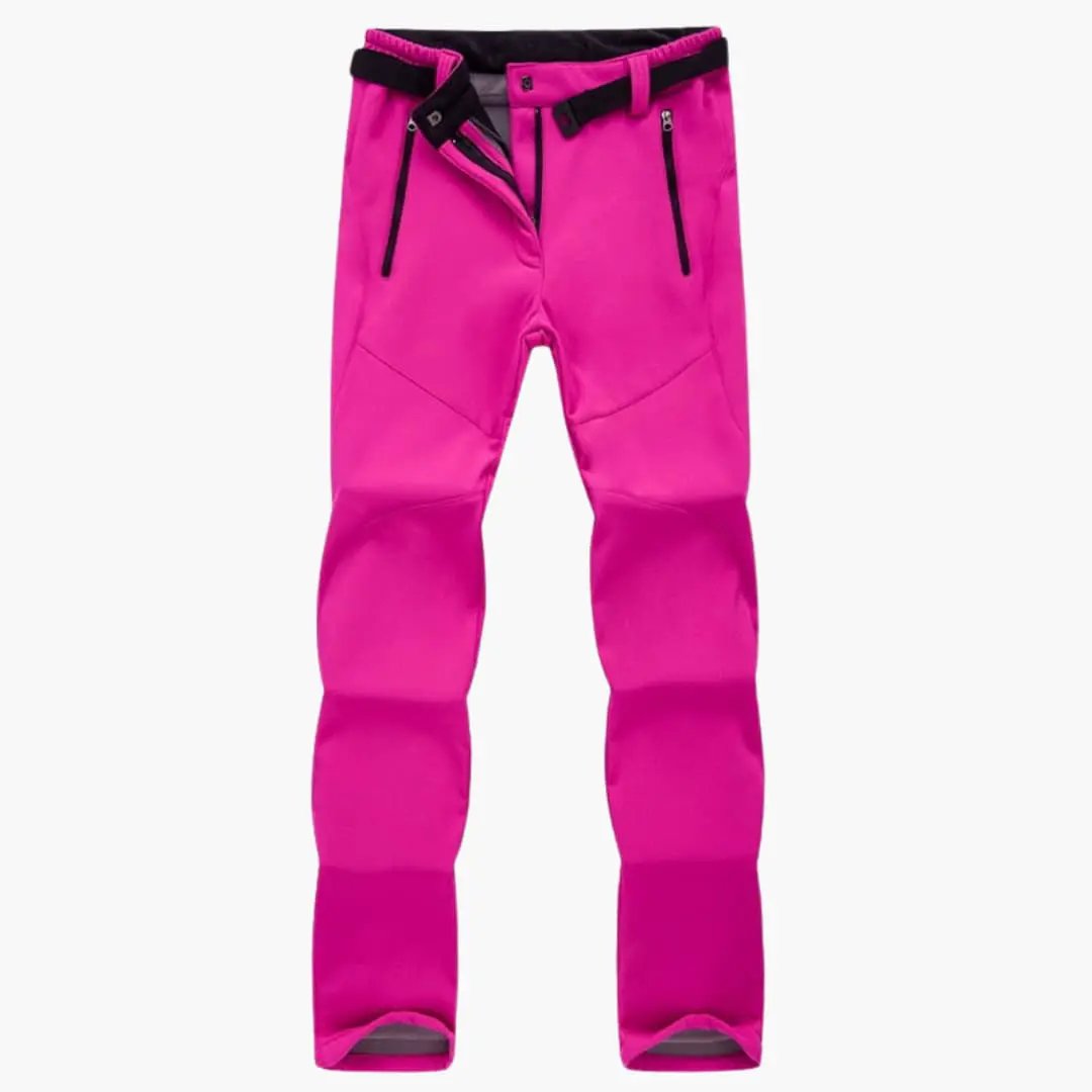 Women's hiking pants with black zipper pockets by Wilfred Smith in hot pink.