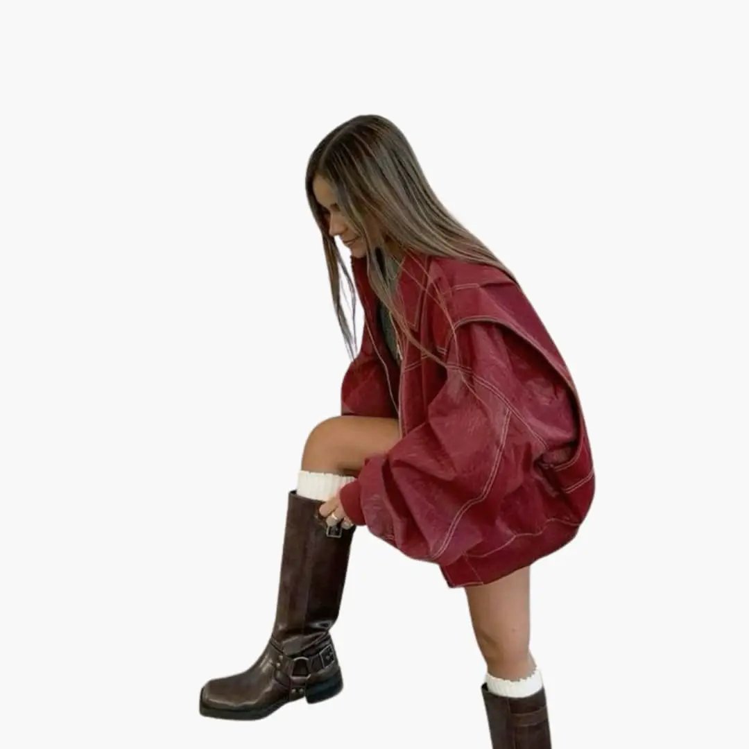 Women's oversized burgundy trucker jacket with long sleeves and contrast stitching.