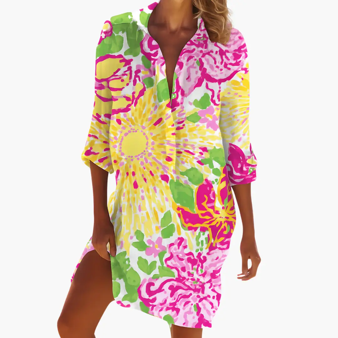 Women's shirt dress with long sleeves and button placket in bright pink, yellow, and green tie-dye print