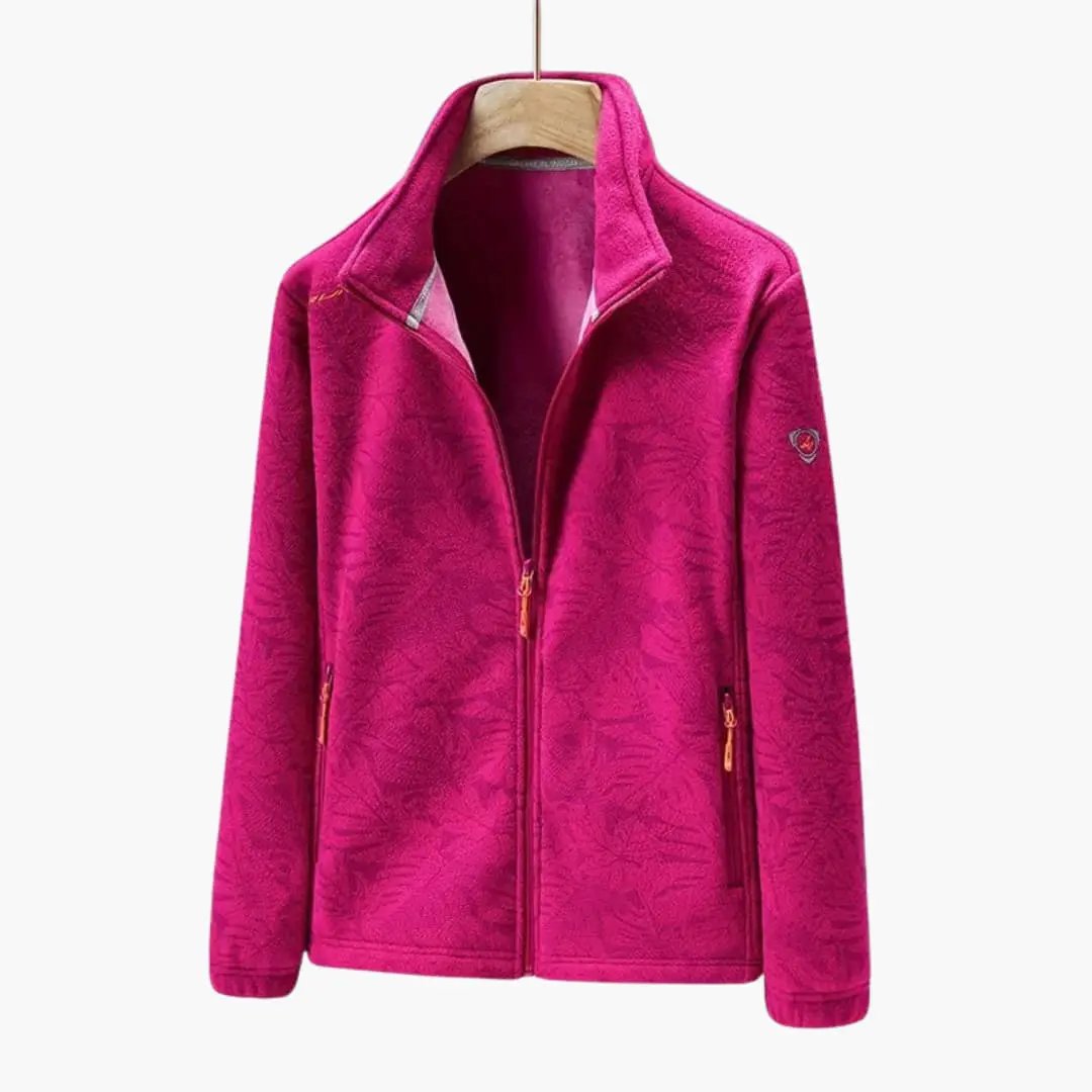 Unisex pink fleece jacket with stand-up collar, full zipper and zippered side pockets; Wilfred Smith logo.