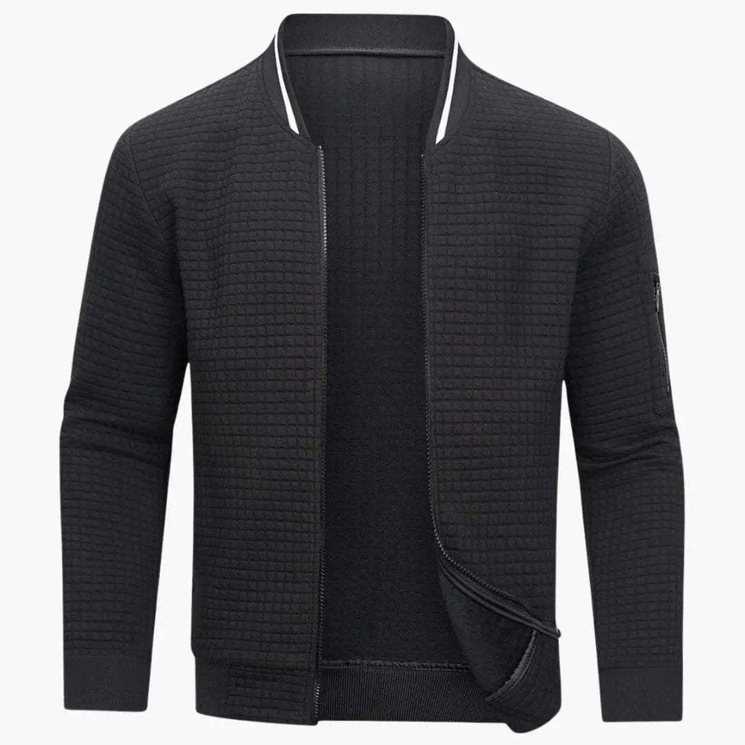 Men's zippered pullover jacket in black with a ribbed quilted texture by Wilfred Smith