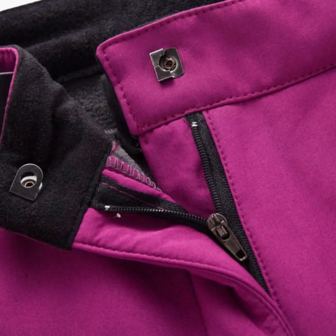 Women's hiking pants by Wilfred Smith in magenta with zipper pockets