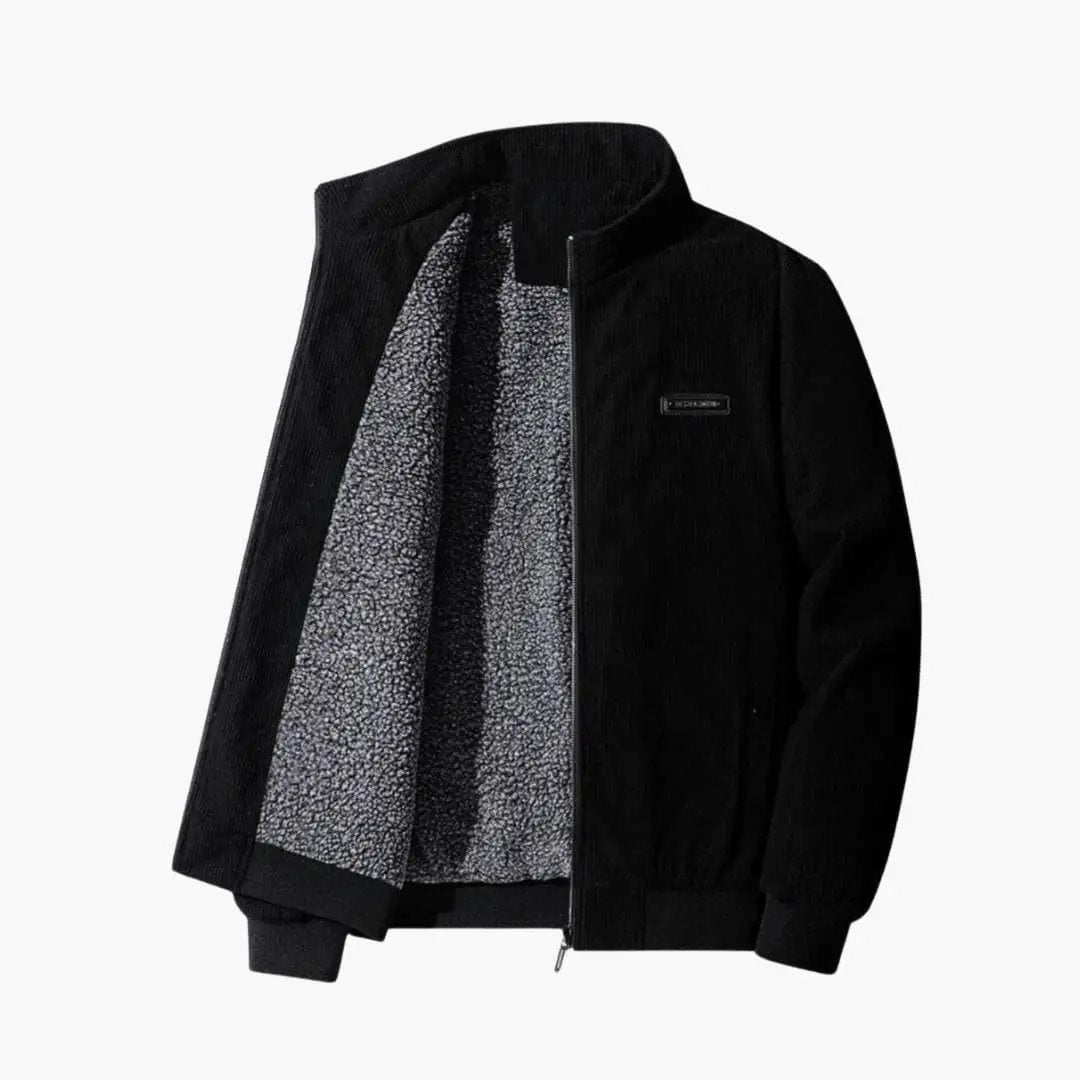 Corduroy jacket for men by Wilfred Smith; black exterior with grey sherpa lining and zip front.