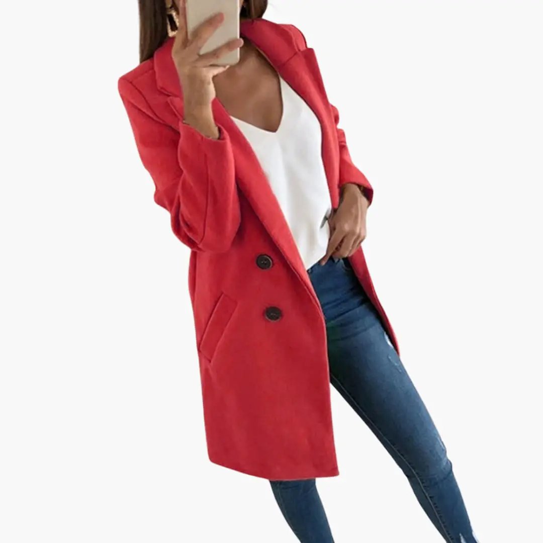 Red button-closure coat for women, longline style with notch lapels, paired with white top and blue jeans.