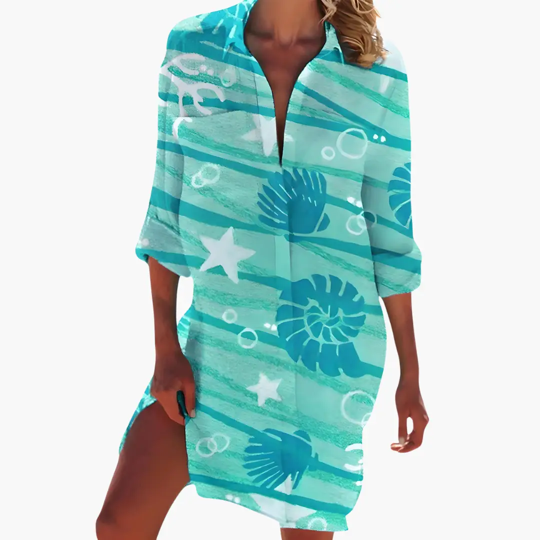 Women's shirt dress with long sleeves in turquoise, button placket, sea shell and starfish print.