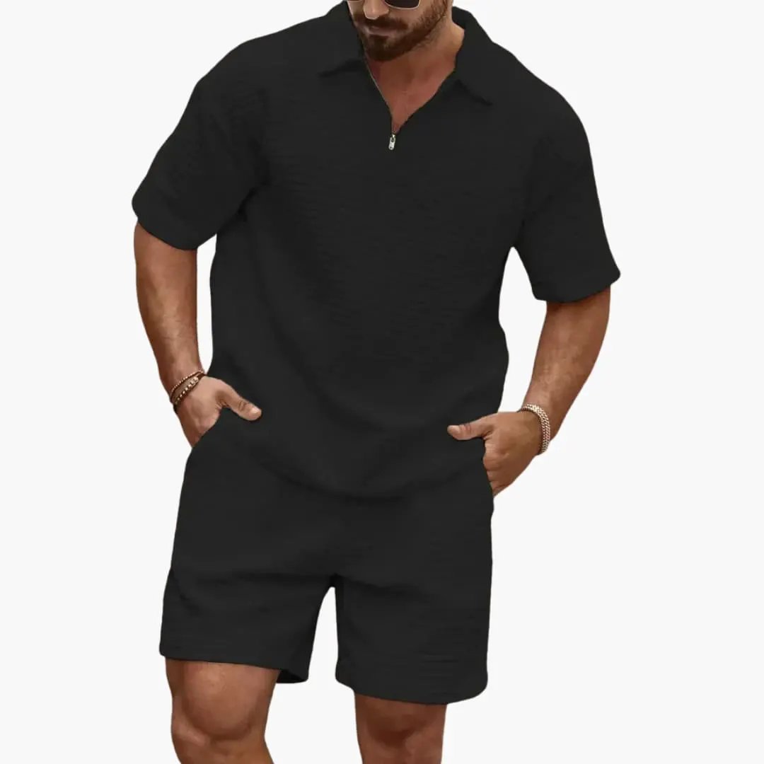 Men's black two-piece set with quilted texture, half-zip top and matching shorts