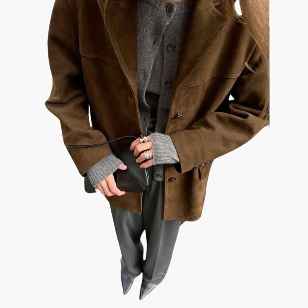 Women's brown suede jacket with button placket, worn over a gray knit sweater.