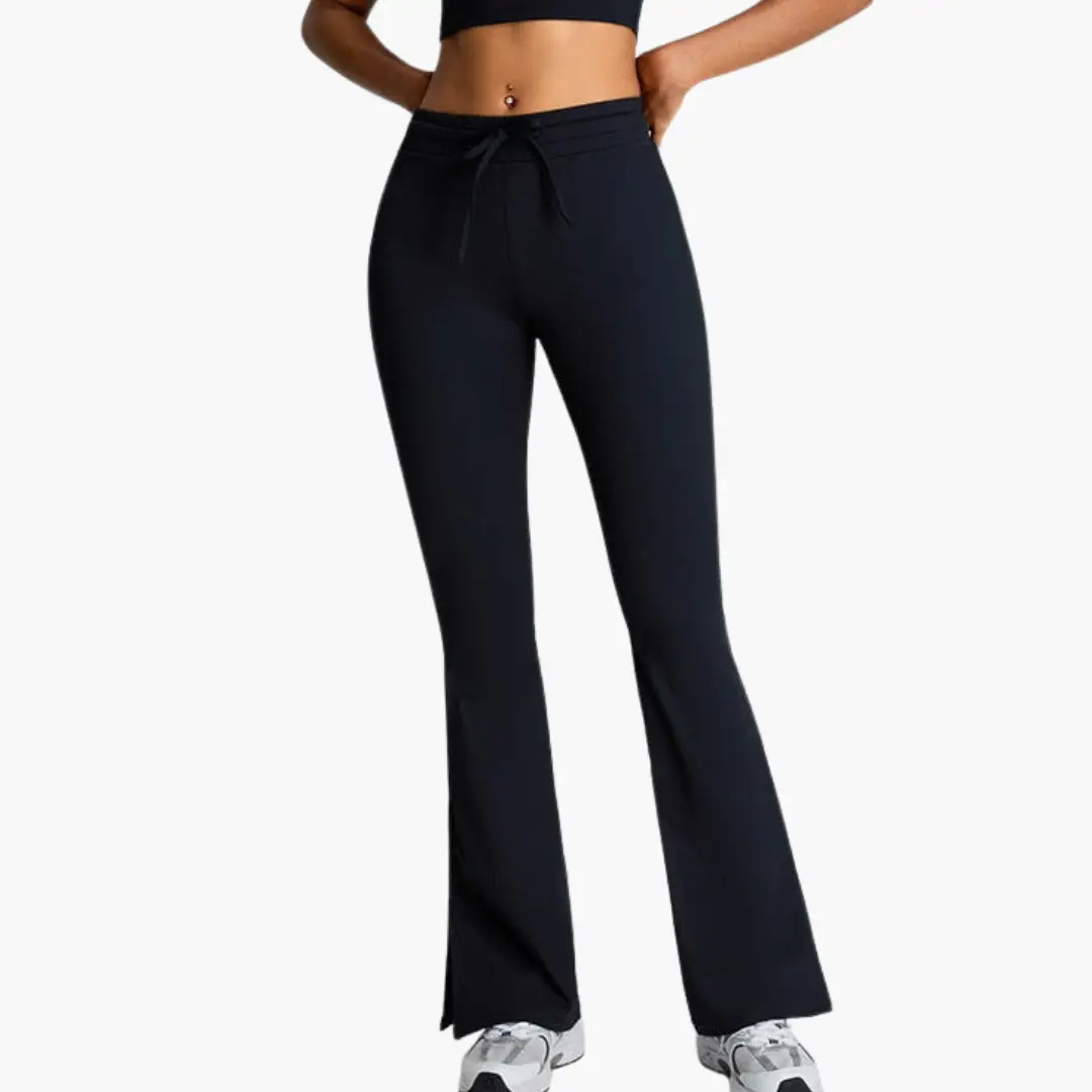 Black high-waist yoga pants by Wilfred Smith with tummy control, drawstring waist, flared legs