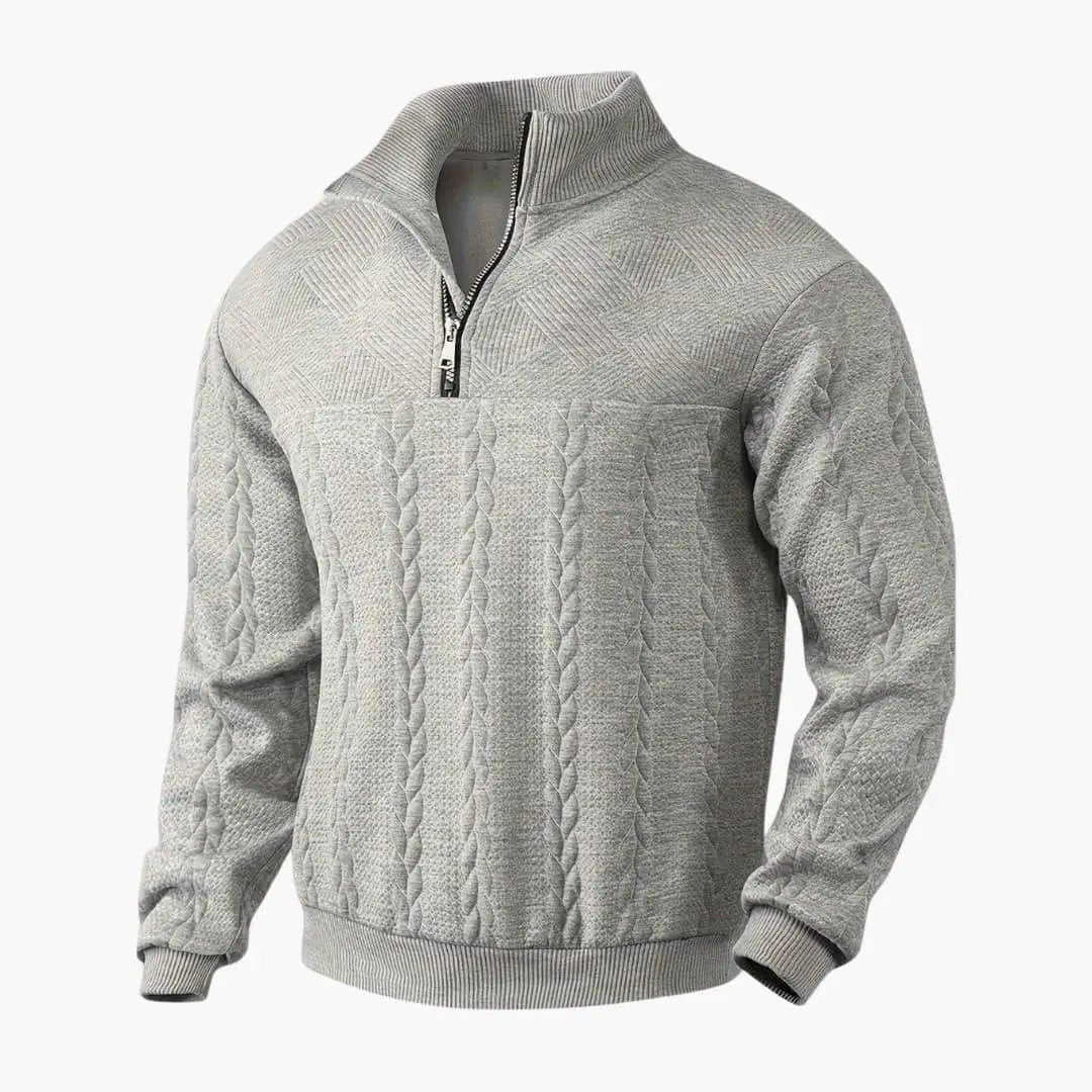 Men's gray cable-knit half-zip pullover with ribbed collar and cuffs.