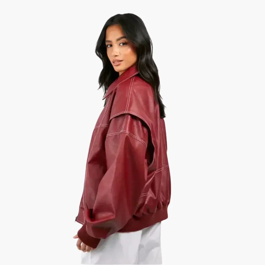 Women's oversized red trucker jacket with long sleeves and white contrast stitching