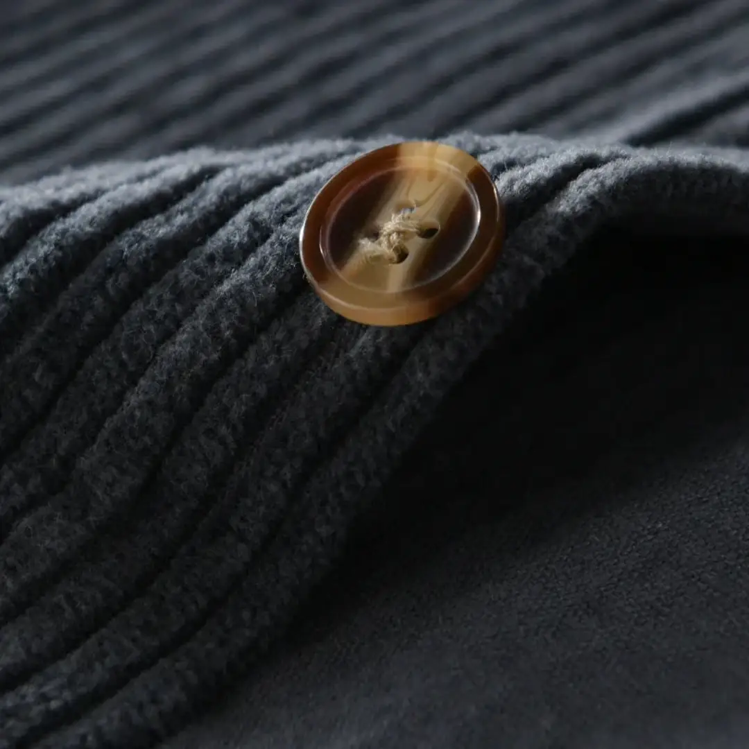 Cord overshirt for men by Wilfred Smith, dark charcoal corduroy with brown button.