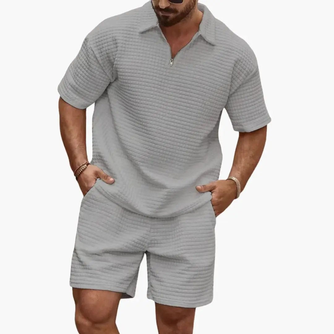 Men's two-piece quilted set with half-zip top and matching shorts in light gray