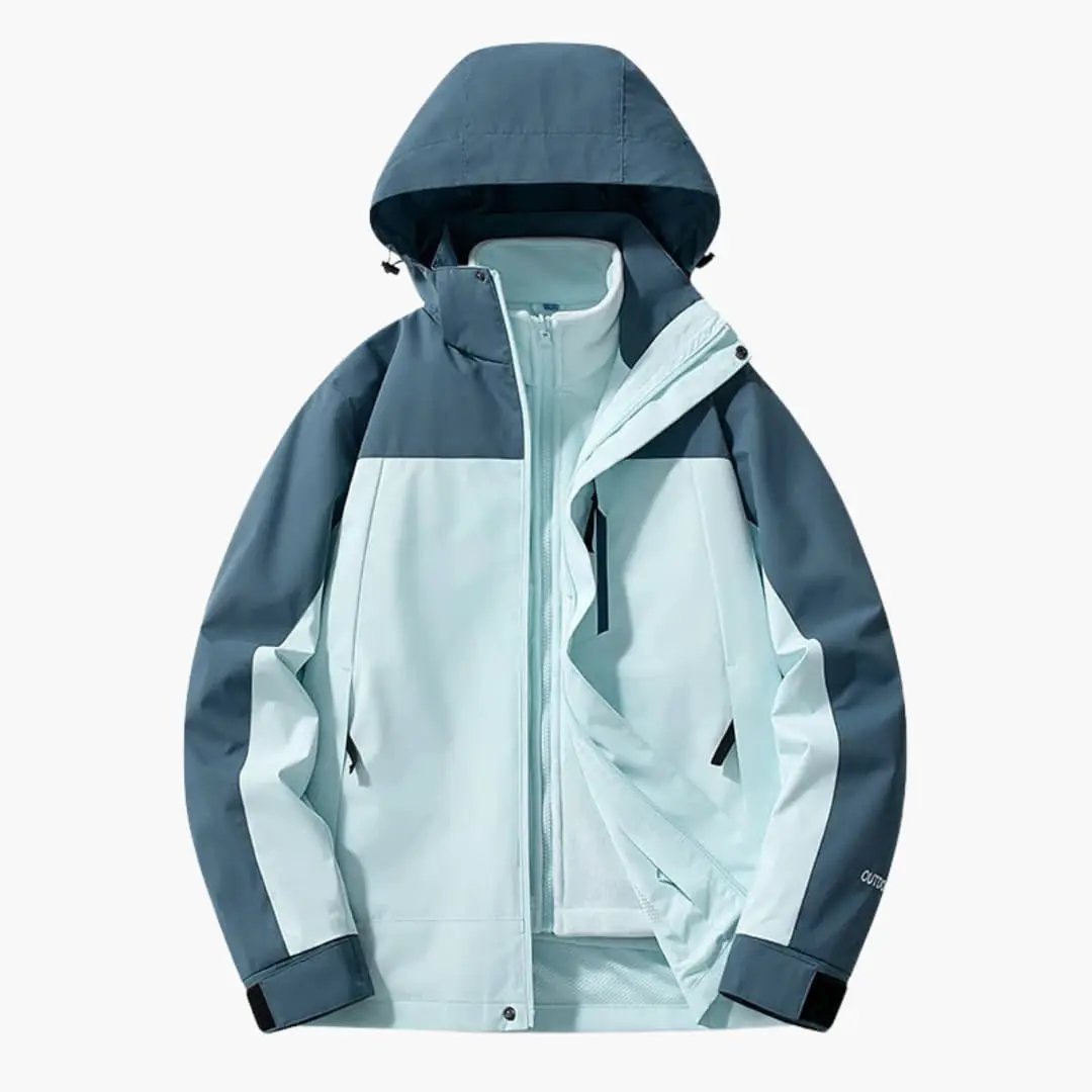 Unisex ski jacket with hood by Wilfred Smith, blue color-blocked with zip pockets.