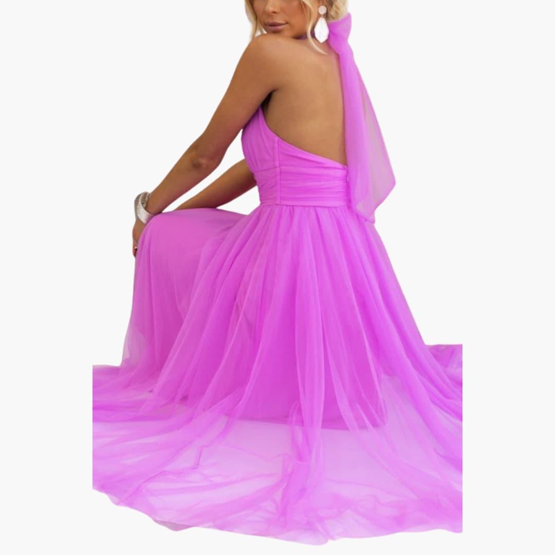 Women's magenta tulle halter-neck dress with flowing skirt and back drape