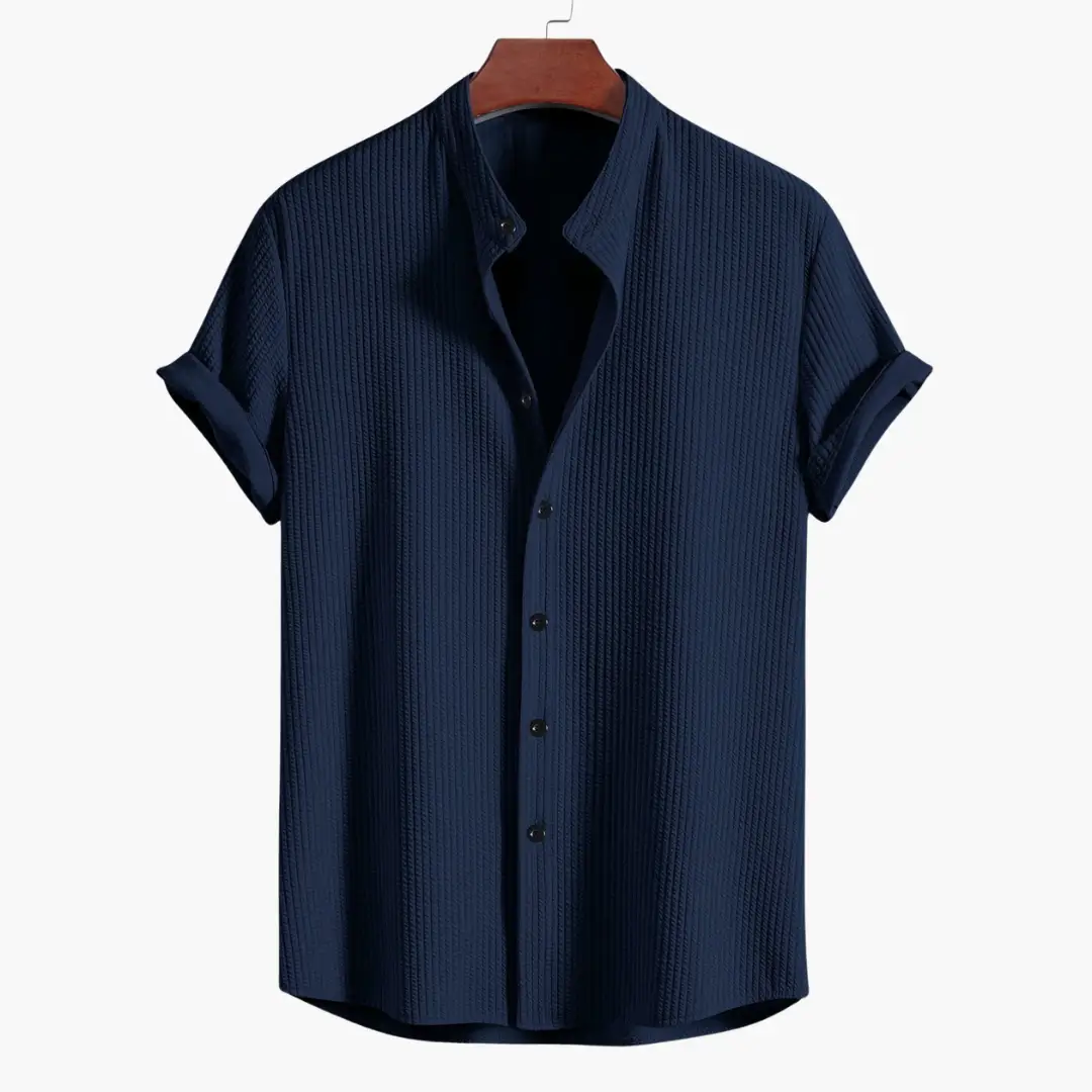 Men's navy ribbed shirt with stand collar by Wilfred Smith; rolled sleeves.