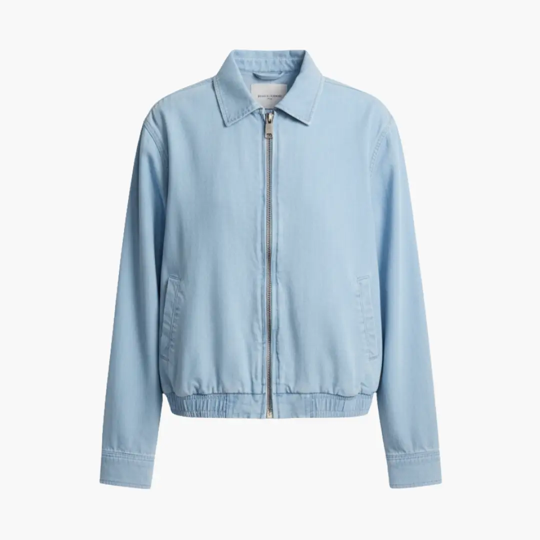Women’s jacket by Wilfred Smith in light blue denim trucker style with zipper and side pockets