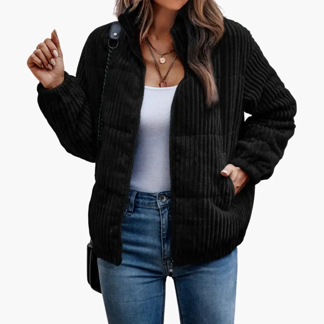 Women’s ribbed jacket with front zipper, black corduroy texture, worn with blue jeans