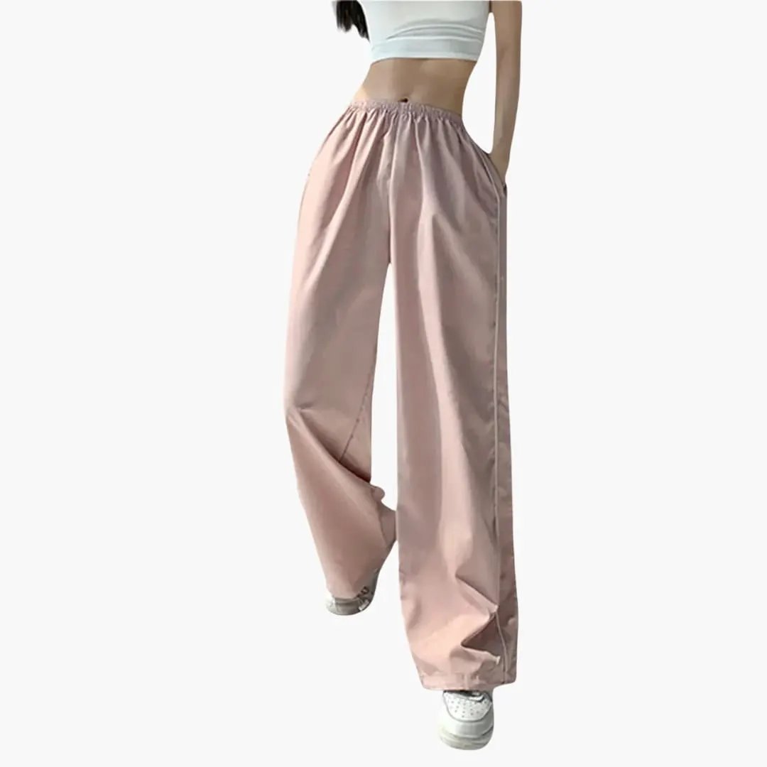 Women's jogging pants with side stripes by Wilfred Smith in pink, baggy fit