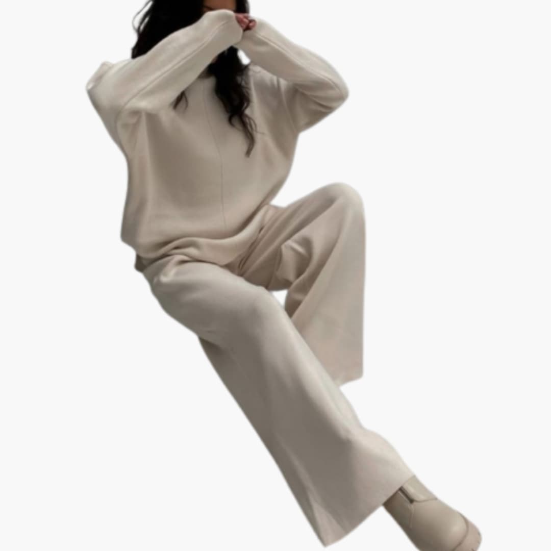Women's loungewear set with beige sweater and wide-leg pants.