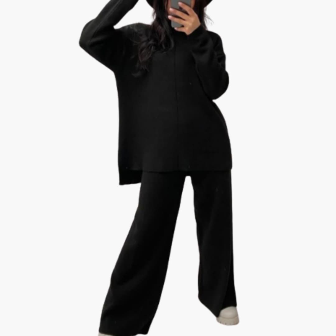 Women's black loungewear set with oversized sweater and wide-leg pants by Wilfred Smith