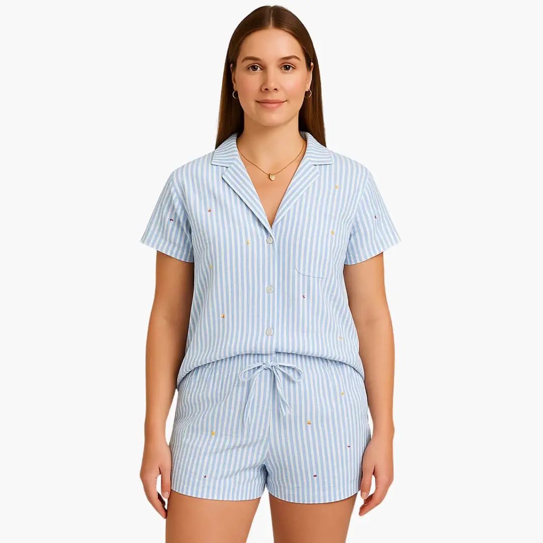 Women's pajama set by Wilfred Smith: short-sleeve striped top with drawstring shorts in light blue and white.