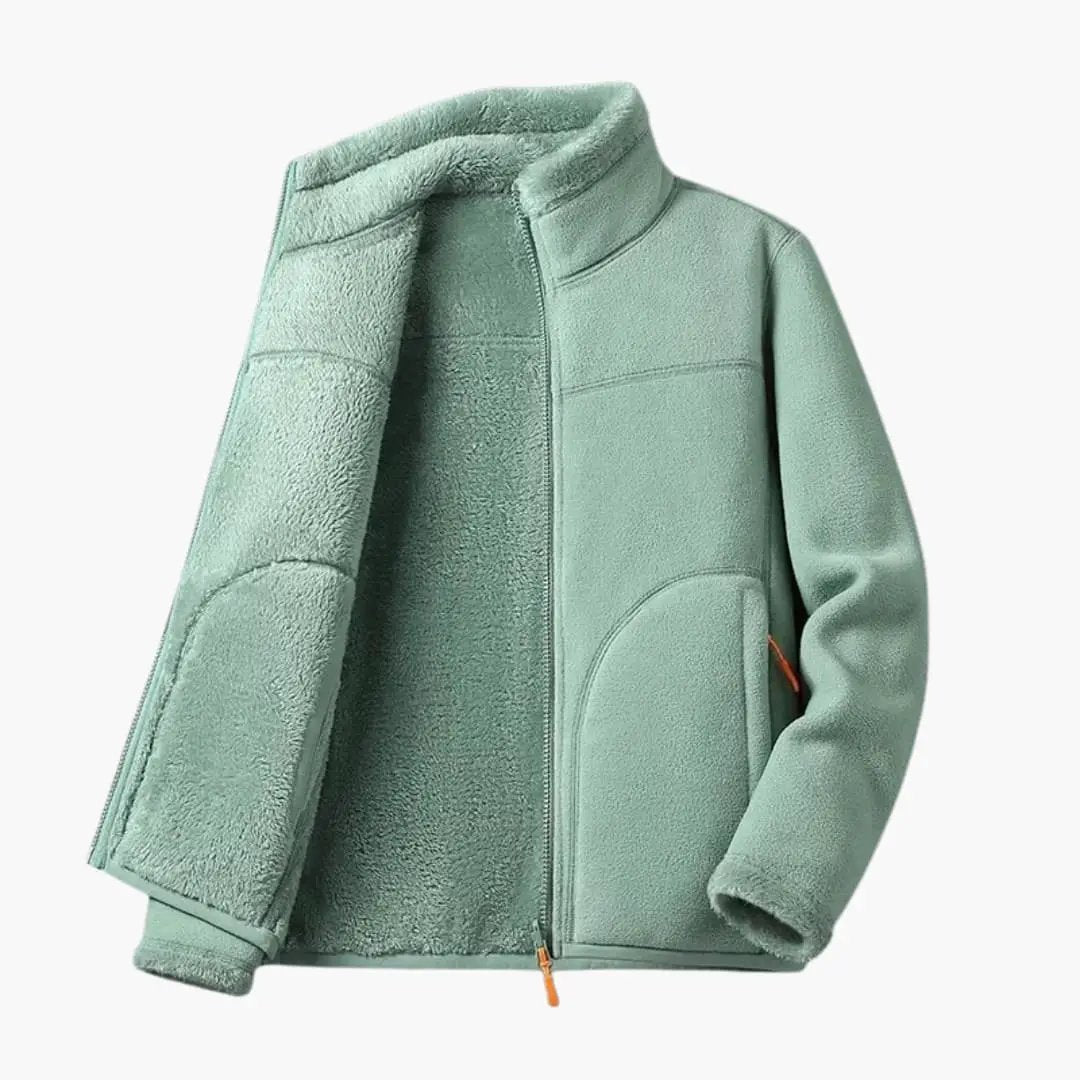Women's mint green fleece jacket with zipper and pockets, orange zipper pull