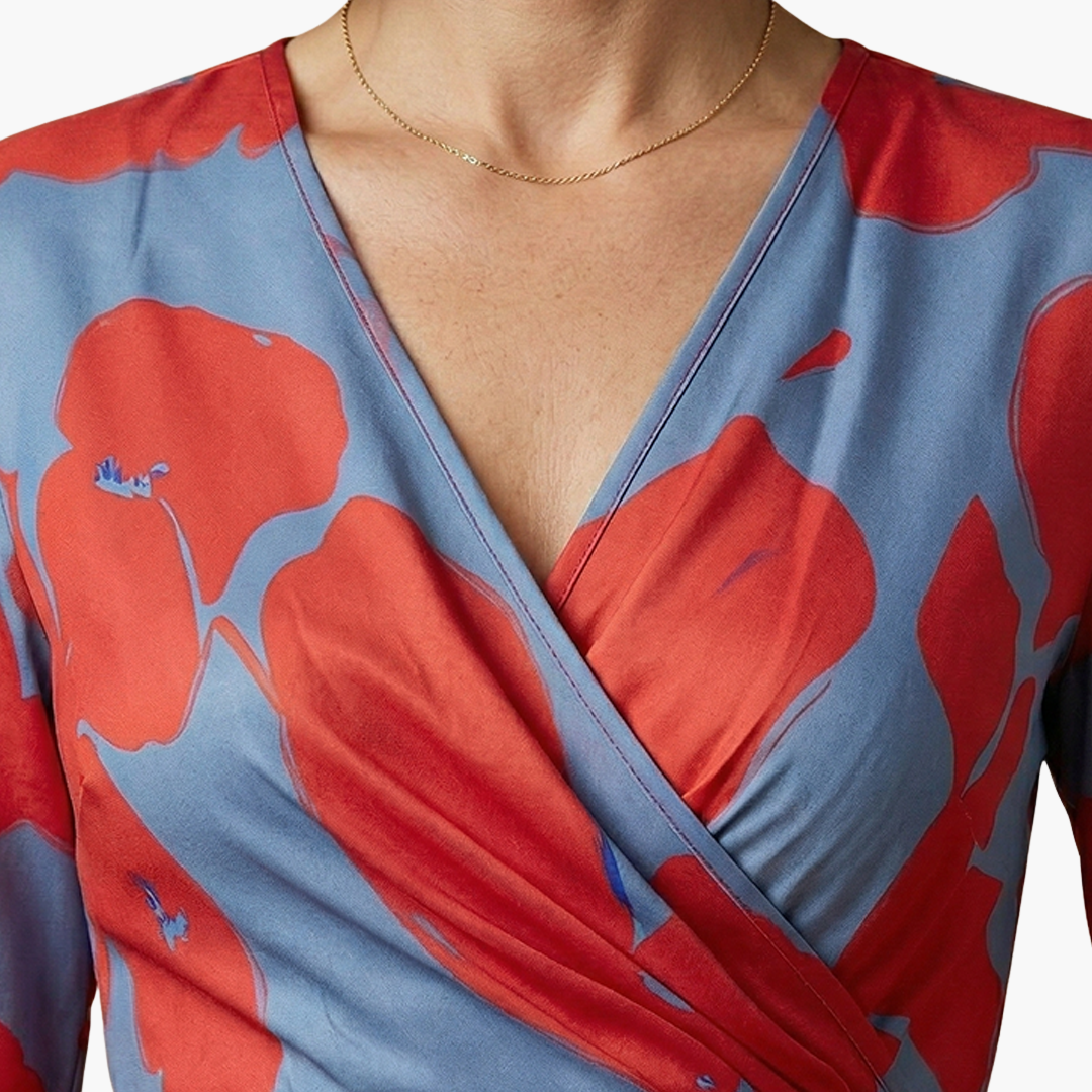 Floral wrap dress with V-neck for women in blue and red print.