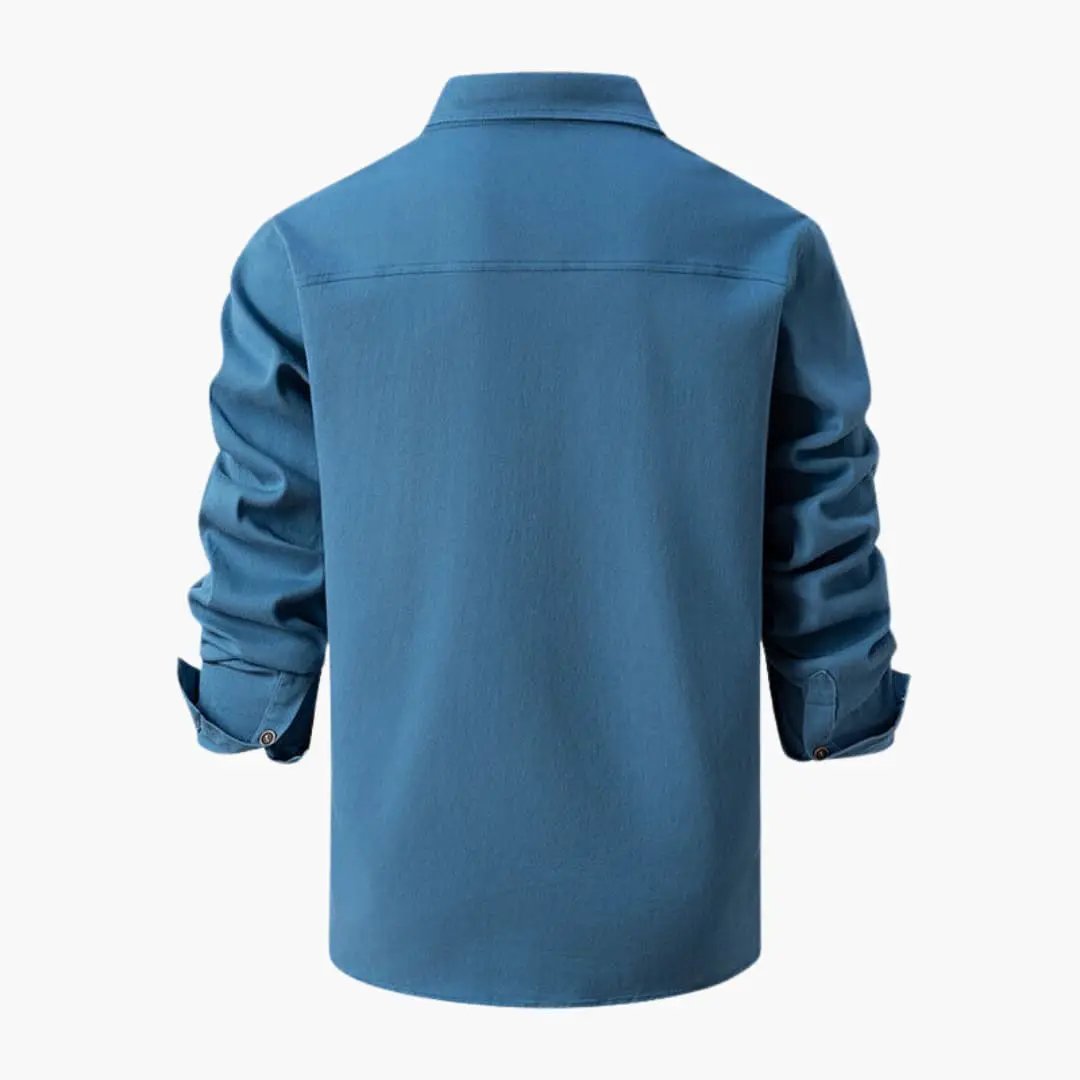 Men's shirt by Wilfred Smith in blue, long sleeves, back view.
