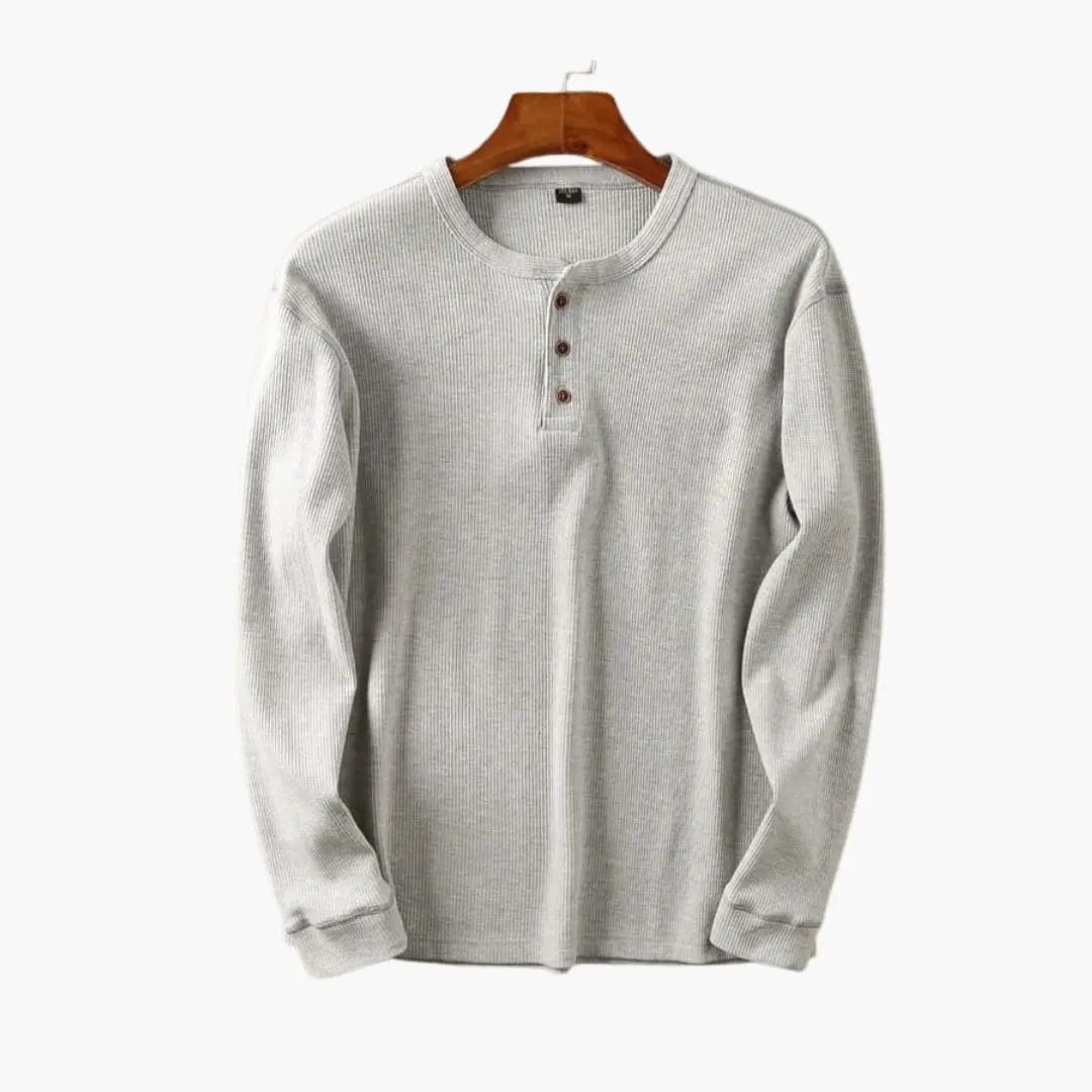 Men's Henley shirt by Wilfred Smith on hanger, light gray ribbed knit with button placket.
