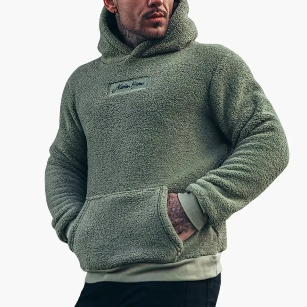 Men's hoodie with ribbed cuffs, olive sherpa fleece, Wilfred Smith logo patch on chest.