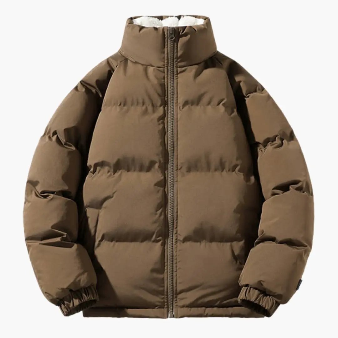 Men’s quilted jacket by Wilfred Smith, tan brown with white lining, full-zip front.