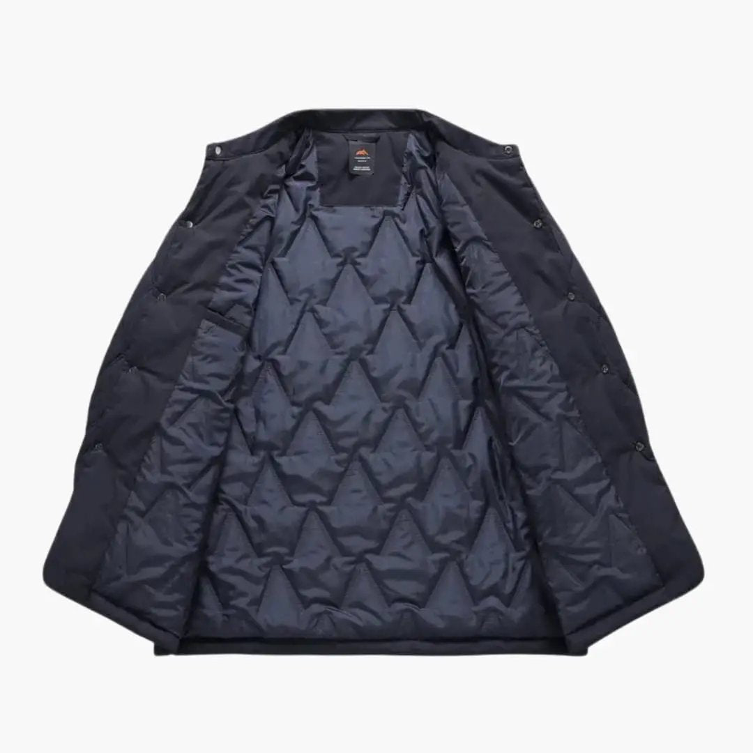 Men's Quilted Jacket with Lapel Collar by Wilfred Smith, navy quilted outer with diamond pattern.