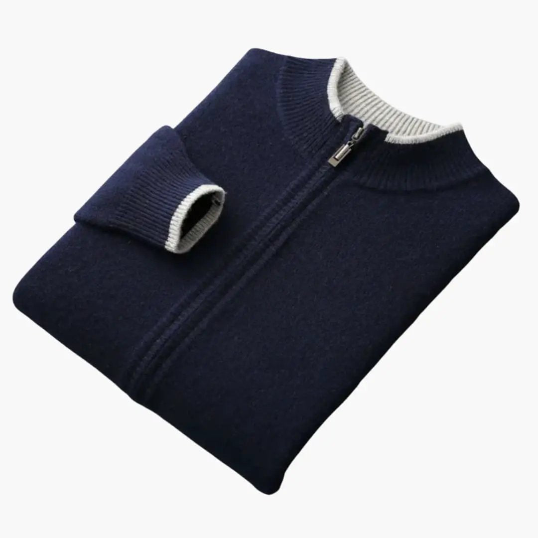 Men's zip-up navy cardigan with white ribbed collar, folded, by Wilfred Smith