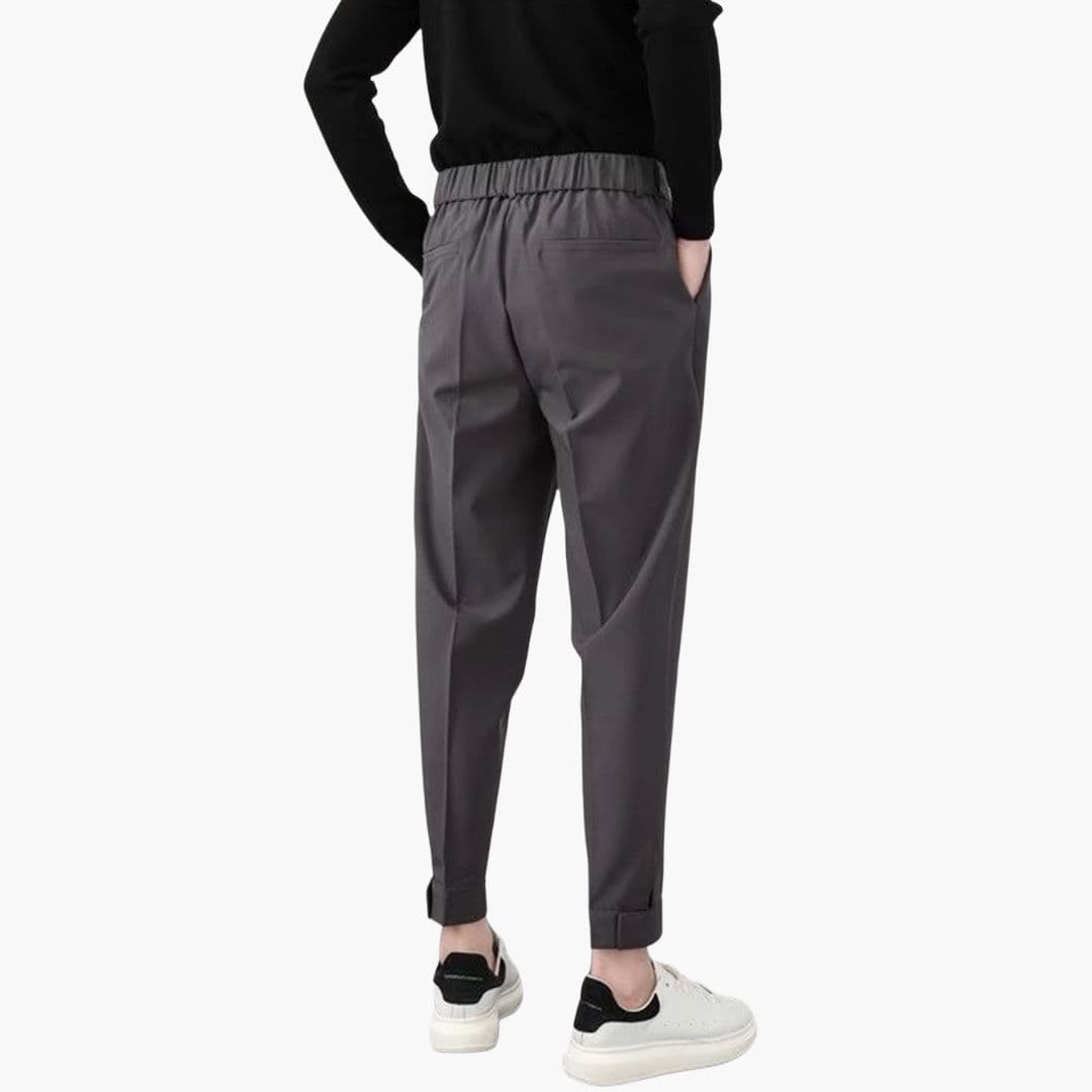 Men's gray tapered-fit trousers with side pockets and elastic waistband