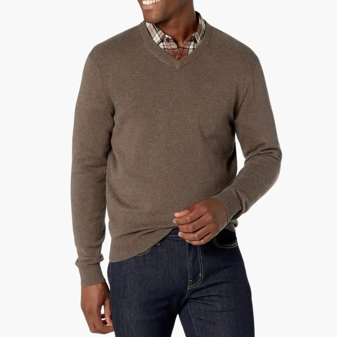 Men's brown V-neck knit sweater with long sleeves, layered over a plaid shirt.