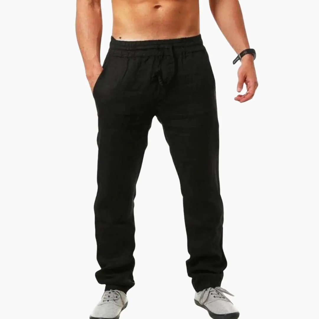 Men's jogging pants with drawstring waist and side pockets in black by Wilfred Smith