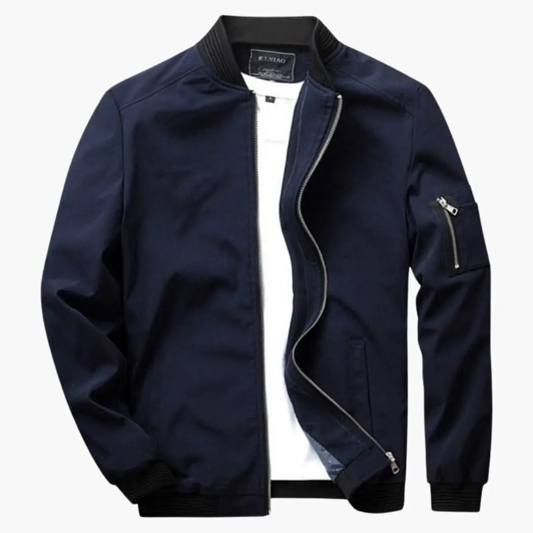 Men's bomber jacket by Wilfred Smith in navy with ribbed cuffs and zip pockets.