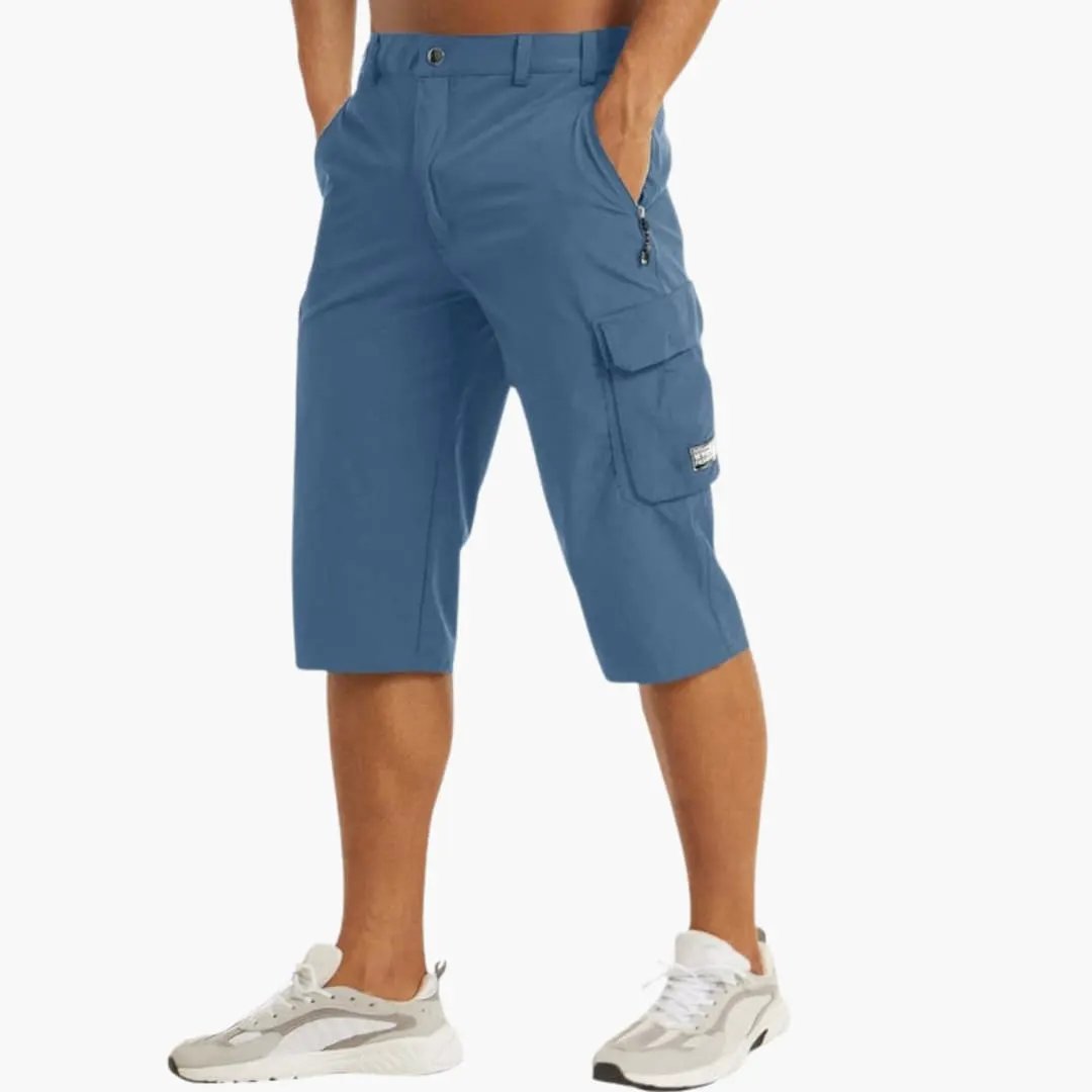 Men's Wilfred Smith cargo shorts in blue, knee-length with stretch fabric and zip pockets.