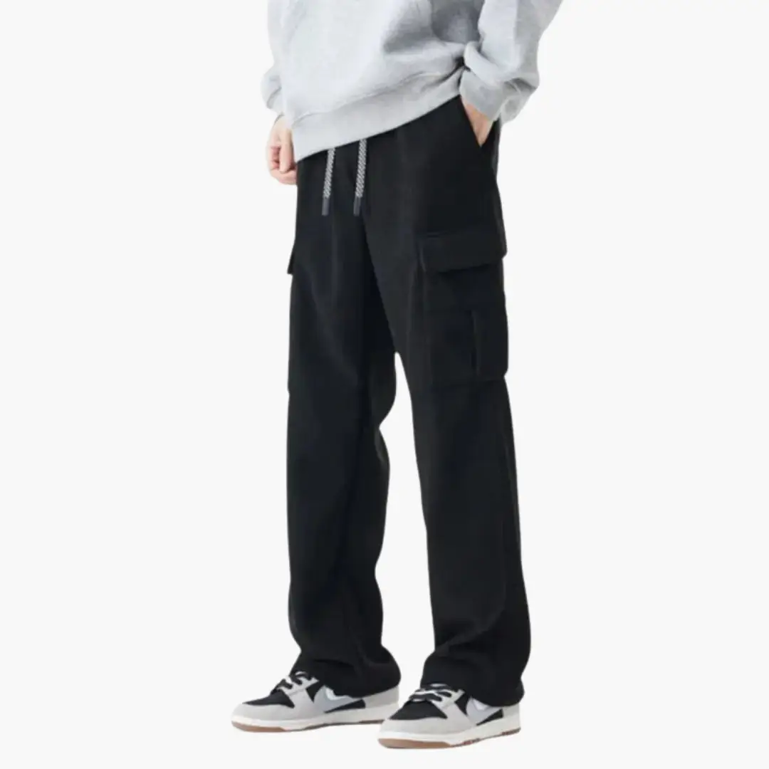 Men’s corduroy cargo trousers by Wilfred Smith in black with drawstring waist and side pockets