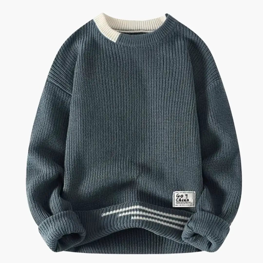 Men's crewneck sweater by Wilfred Smith in deep navy knit with ribbed hem and cuffs.