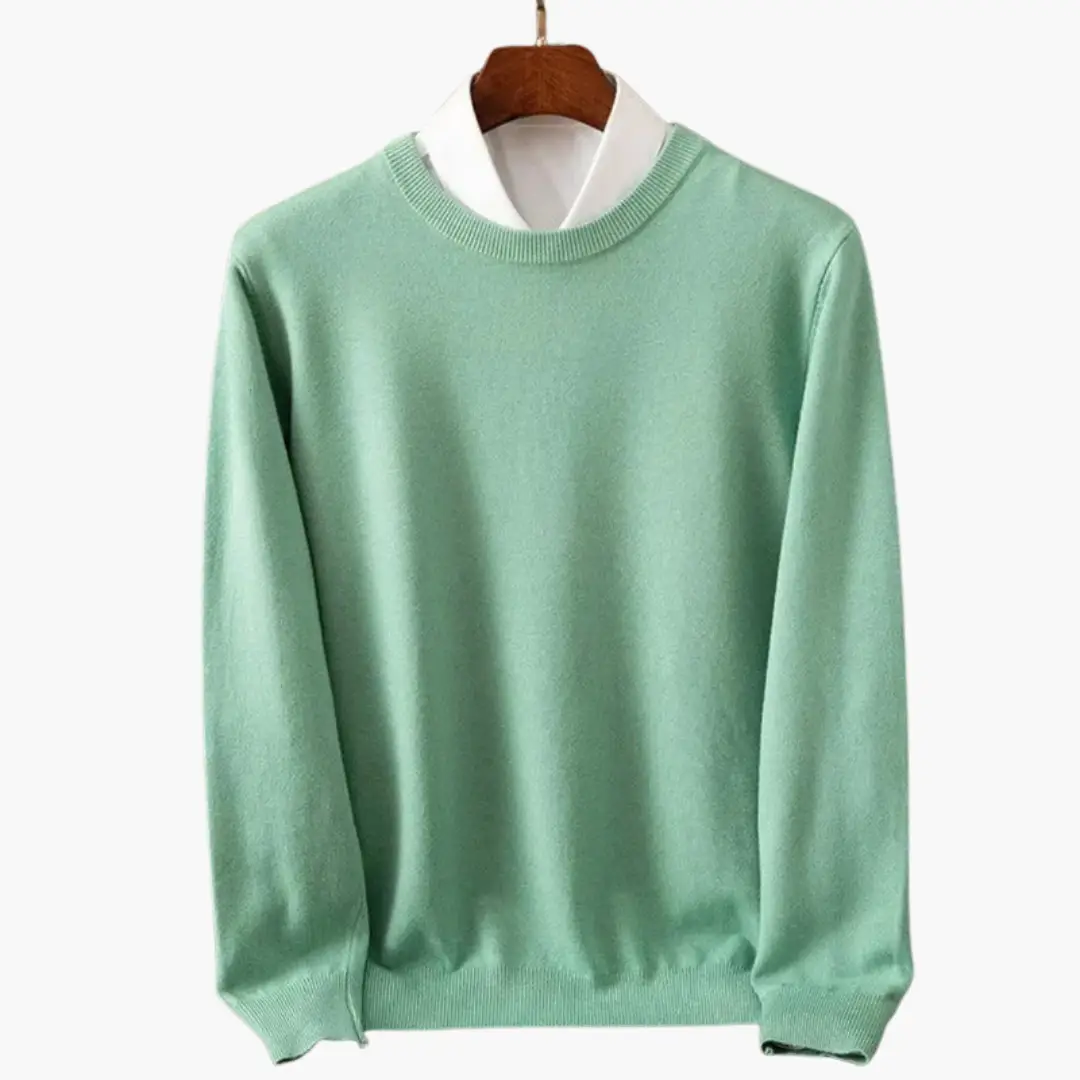Men’s mint green crew-neck sweater layered over a white shirt, long sleeves with ribbed cuffs and hem.