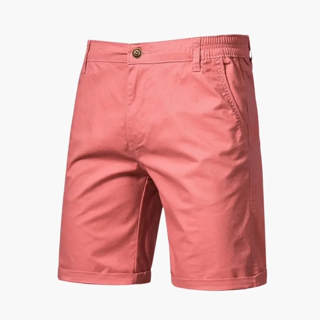 Men's knee-length pink chino shorts by Wilfred Smith with belt loops and zip closure
