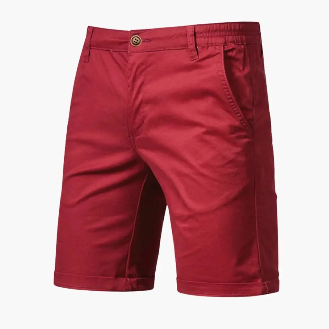 Men's knee-length chino shorts by Wilfred Smith in red with belt loops and zip closure