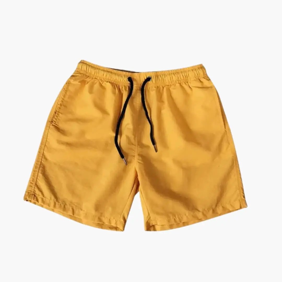 Men's knee-length jogger shorts in mustard yellow with black drawstring and zip pockets