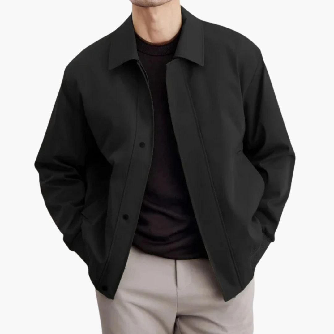 Men’s black overcoat with pointed collar and button closure
