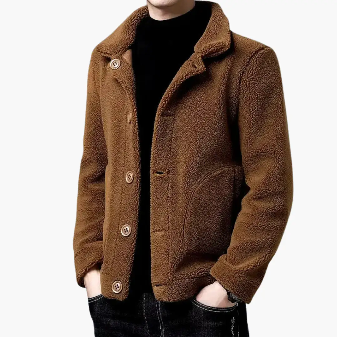 Men’s short sherpa jacket by Wilfred Smith in brown with lapel collar and front pockets.