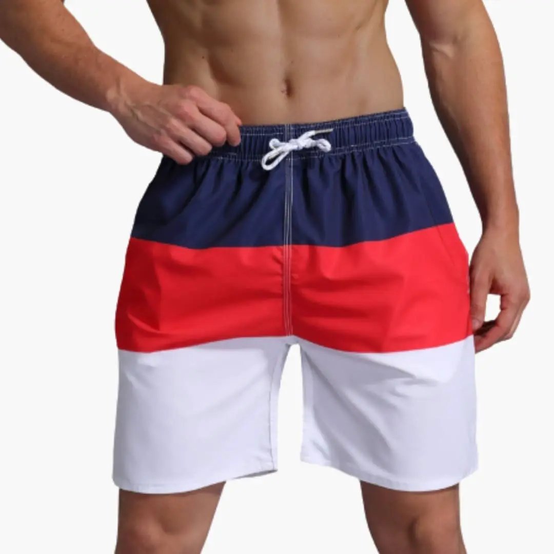 Men's Wilfred Smith boardshorts, striped navy/red/white with drawstring waist.