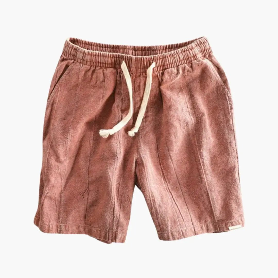 Men's knee-length jogger shorts with elastic waistband and white drawstring in dusty pink